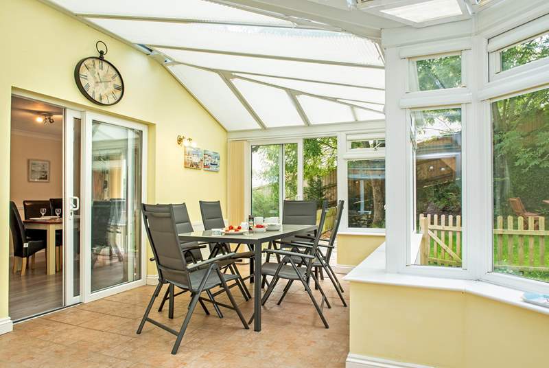 The conservatory is a lovely place to enjoy holiday meals or simply to unwind and relax whilst the children play in the garden.
