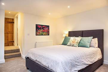 Bedroom 1 has a super-comfy king-size bed and two steps lead up to the en suite.