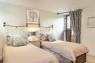 A door leads from the twin bedroom to the enclosed garden.