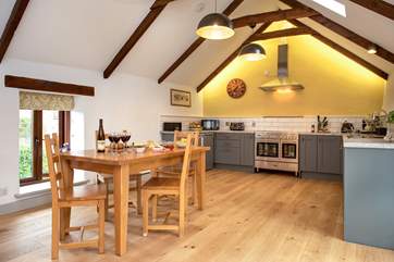 The kitchen and dining areas in the open plan living-room.