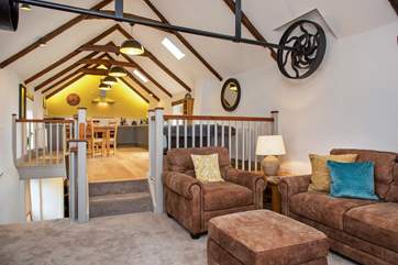 The different levels in the open plan living-room provide a sense of separation.