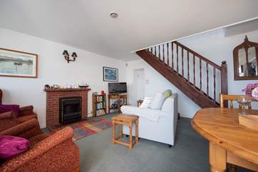Stairs lead up to the first floor bedroom.