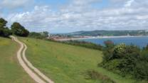 The World Heritage Jurassic Coast is just a five mile drive away, stretching through east Devon and over the border at Lyme Regis into Dorset. Seaton, the nearest beach, is in the distance.