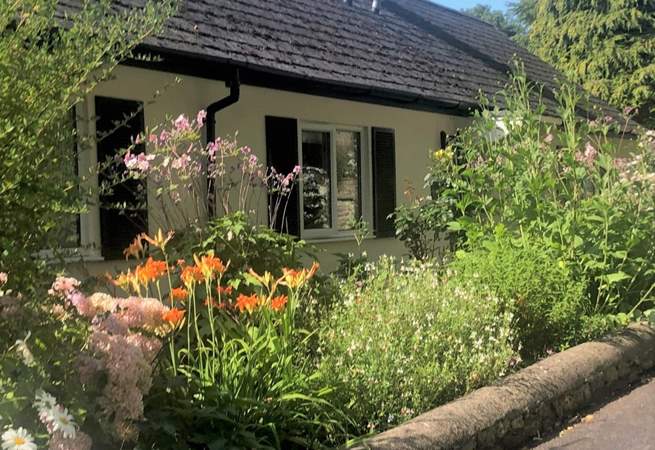 The Coach House is embraced with beautiful flower borders and has its own beautiful gardens, set within the grounds of a country house. There are a couple of steps down to the front door and then one up. 