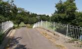 The Coach House is approached along this private road across the Axe Valley. There are footpaths along the river banks for you to enjoy with your dog. - Thumbnail Image