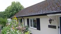 This single-storey cottage is exceptional high quality, with plenty of  private parking, a terrace and extensive gardens.