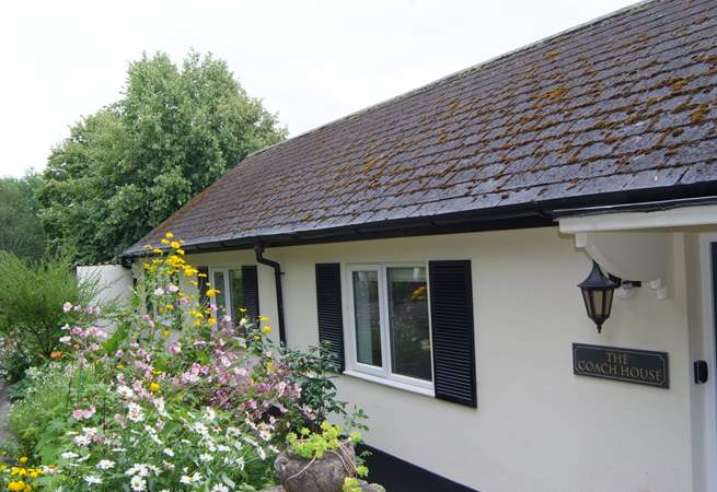 This single-storey cottage is exceptional high quality, with plenty of  private parking, a terrace and extensive gardens.