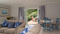 The sitting/dining-room has French windows out onto a lovely terrace for al fresco dining.