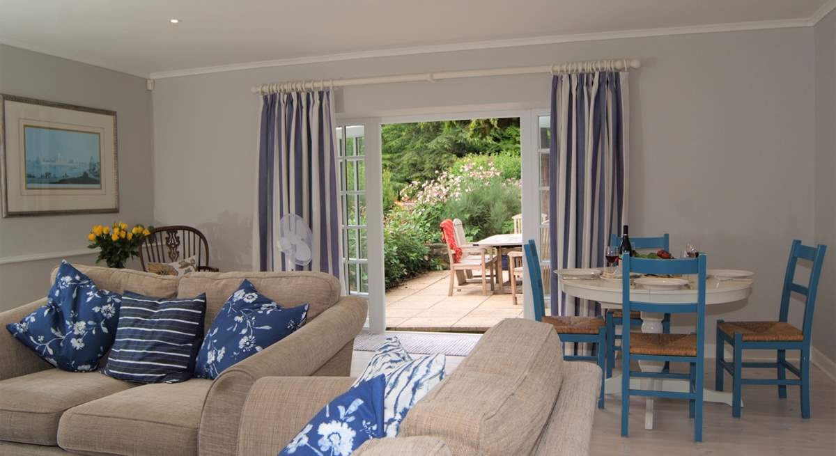 The sitting/dining-room has French windows out onto a lovely terrace for al fresco dining.