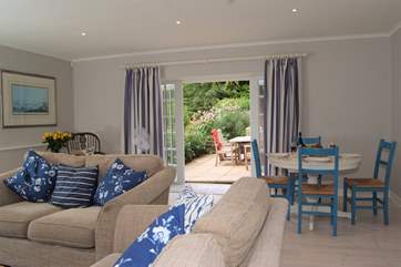The sitting/dining-room has French windows out onto a lovely terrace for al fresco dining.