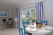The circular dining-table extends if you wish.