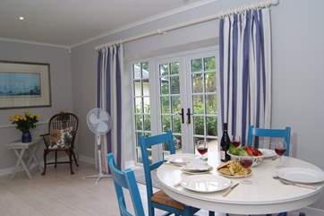 The circular dining-table extends if you wish.