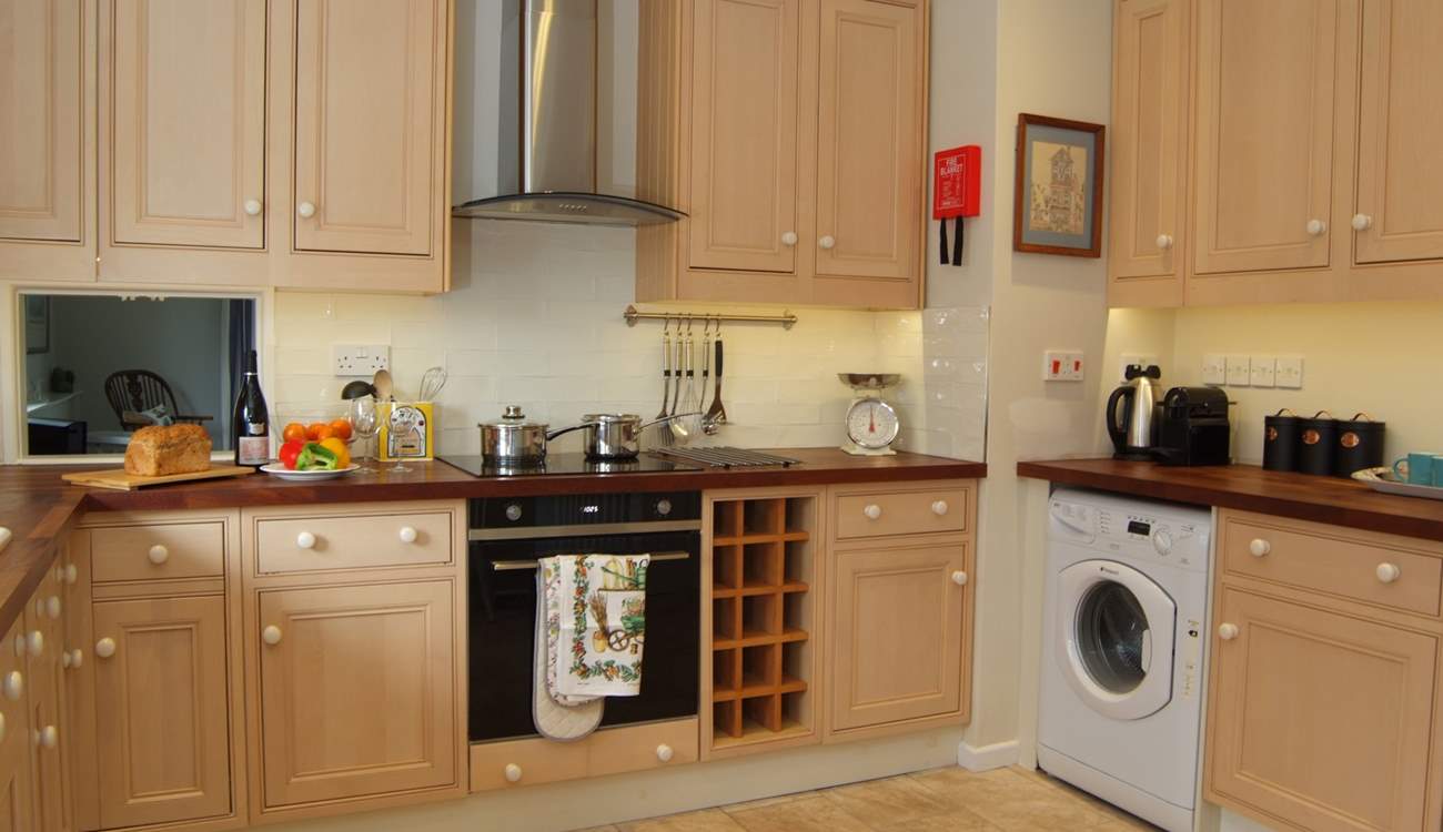 The kitchen is well-equipped and offers plenty of space. 