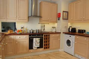 The kitchen is well-equipped and offers plenty of space.