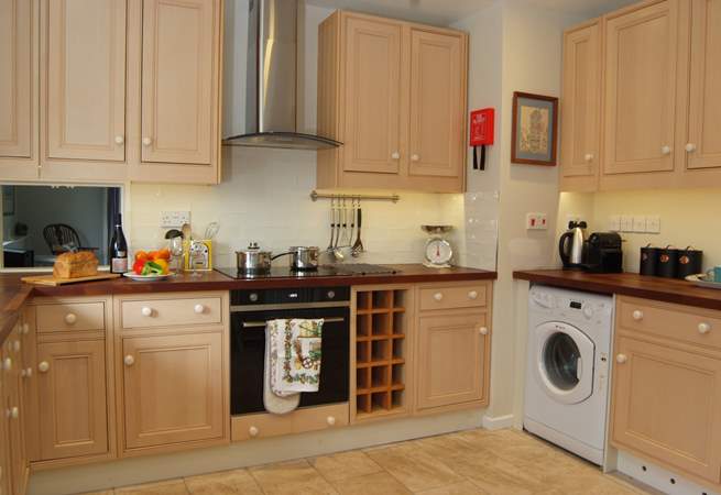 The kitchen is well-equipped and offers plenty of space. 