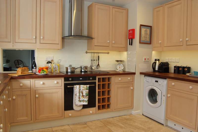 The kitchen is well-equipped and offers plenty of space. 