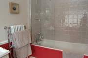 The en suite bathroom is bright and cheerful.