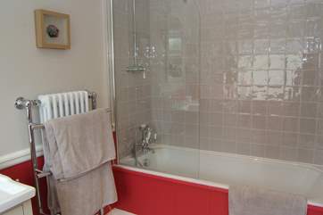 The en suite bathroom is bright and cheerful.
