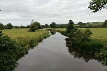 This is the river Axe. You cross the river to reach the Coach House and there are footpaths all along the banks.