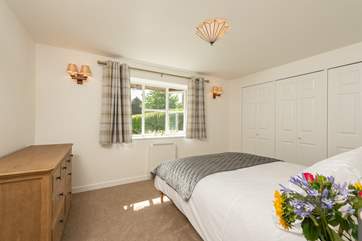 The master bedroom looks out over the garden.