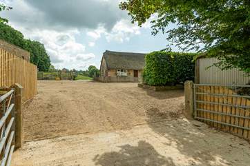 This is the entrance to the farmyard - your parking is to the right in front of the Lodge.