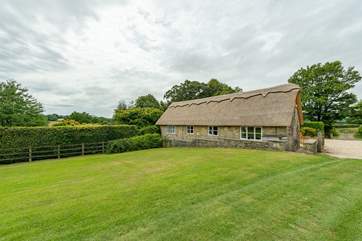 Old Sandpitts Lodge has recently had a lovely new thatch roof.