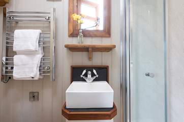 There's a wash-basin, WC and heated towel rail too.