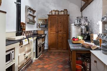 The cottage Rayburn helps create a wonderful warm welcome.