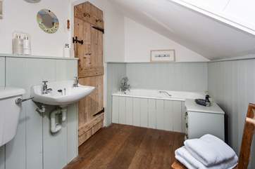 The cottage-style family bathroom.