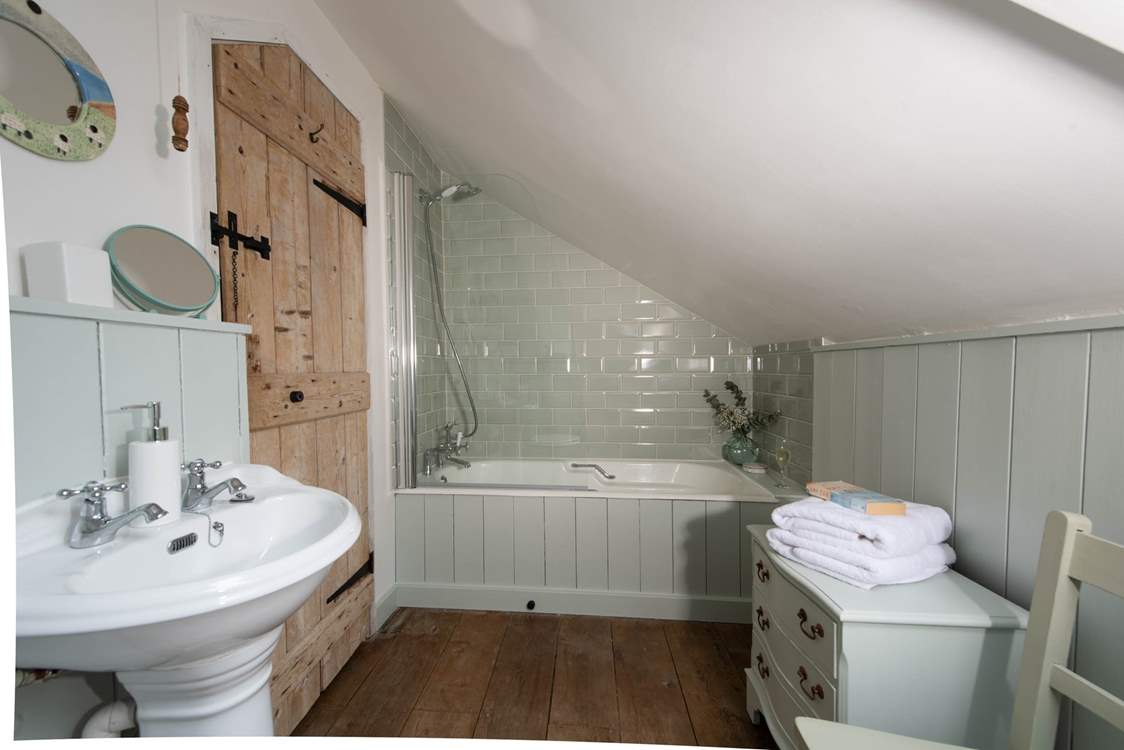 The cottage-style family bathroom.