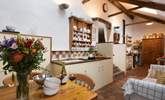 The cottage kitchen/diner is full of charm and character. Three reclaimed brick steps lead up to the sitting-room. - Thumbnail Image