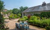 The pretty courtyard at the front of Primrose Cottage, a perfect spot to either start or end  your day.  - Thumbnail Image