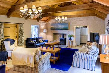 The spacious and luxurious sitting-room is a wonderful place for all to gather.