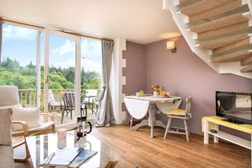 The sitting/dining-room leads out to the raised decking-area.