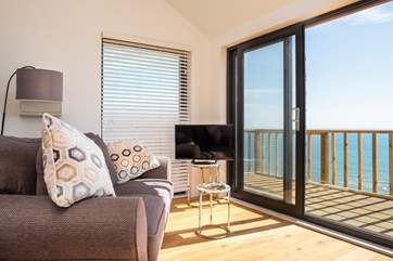 The vista can even be enjoyed from the squishy sofa.