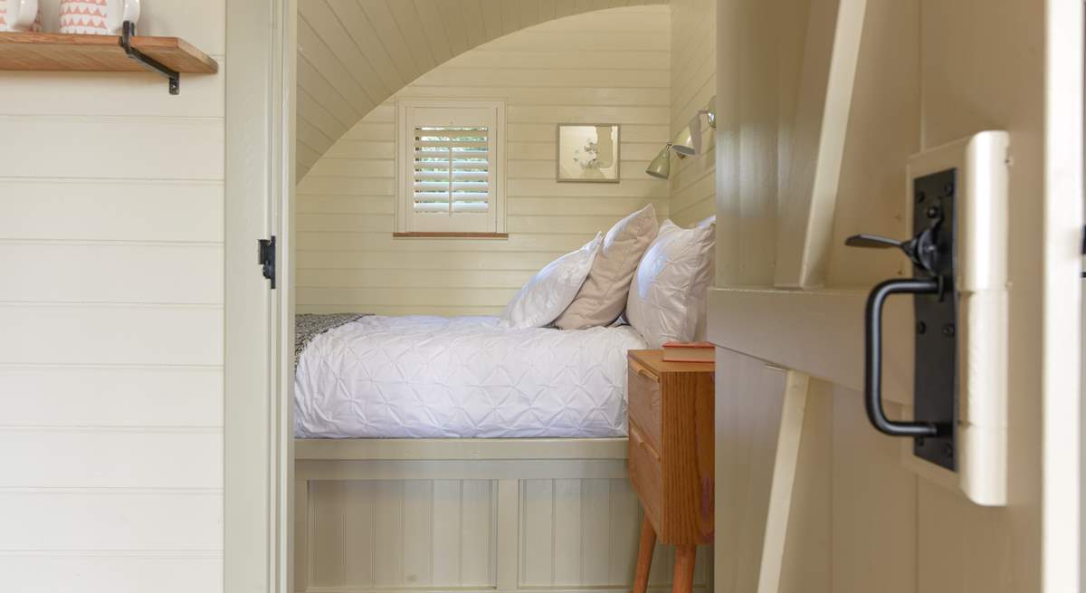 A door leads through from the living area into the lovely bedroom.