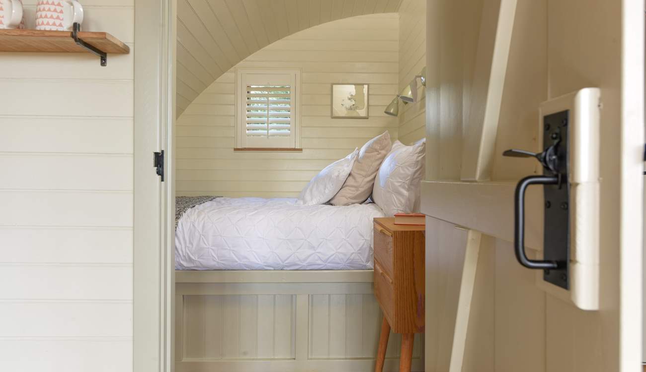A door leads through from the living area into the lovely bedroom.