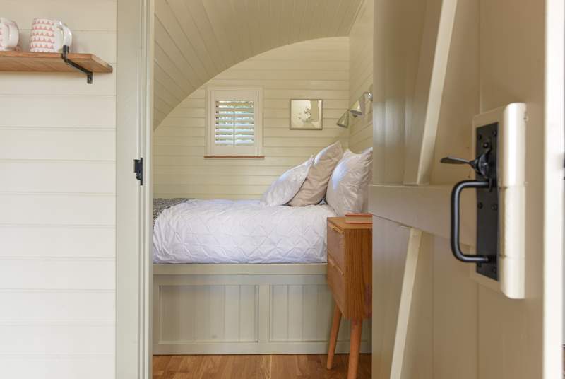A door leads through from the living area into the lovely bedroom.