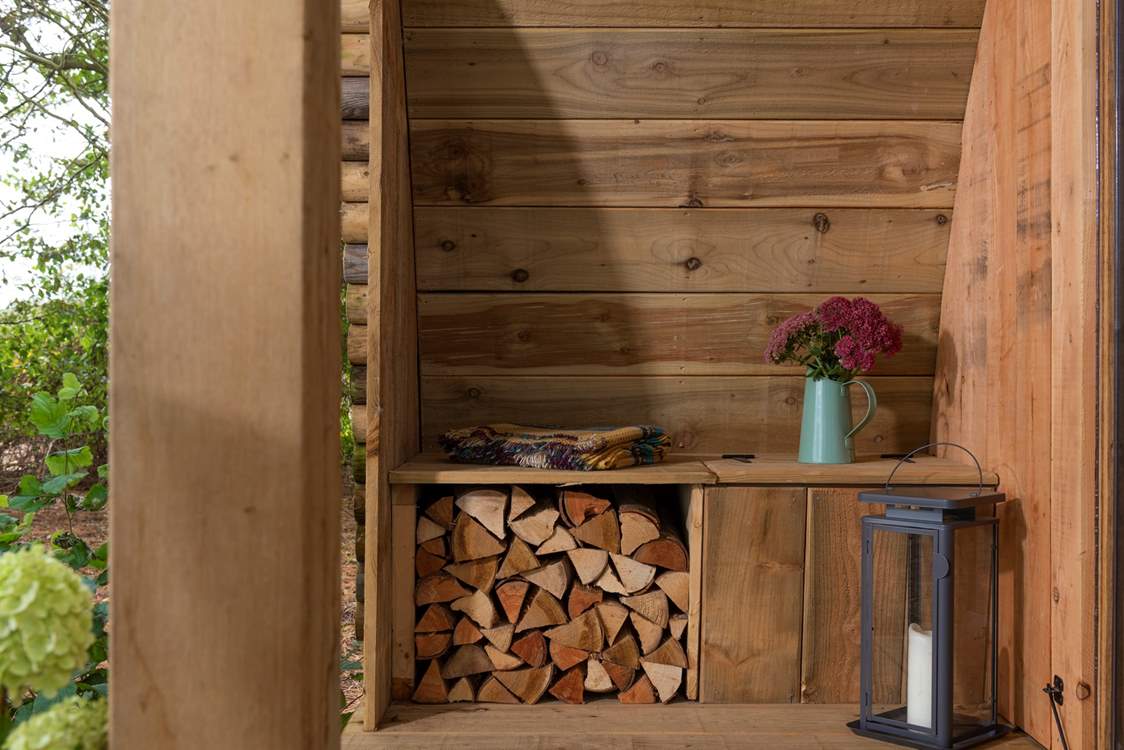 Logs for the wood-burner are provided.