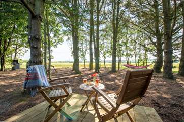 Whilst enjoying the far-reaching views and magical woodland setting.
