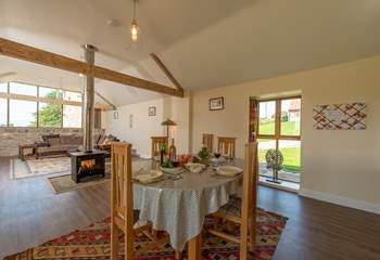 There is the most fabulous open plan living-space with a double-sided wood-burning stove at its heart.