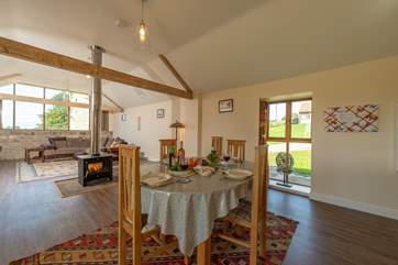 There is the most fabulous open plan living-space with a double-sided wood-burning stove at its heart.