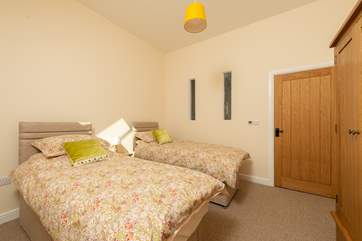 This is the twin bedroom with comfortable three-foot twin beds. The family bathroom is right next to it along the corridor.