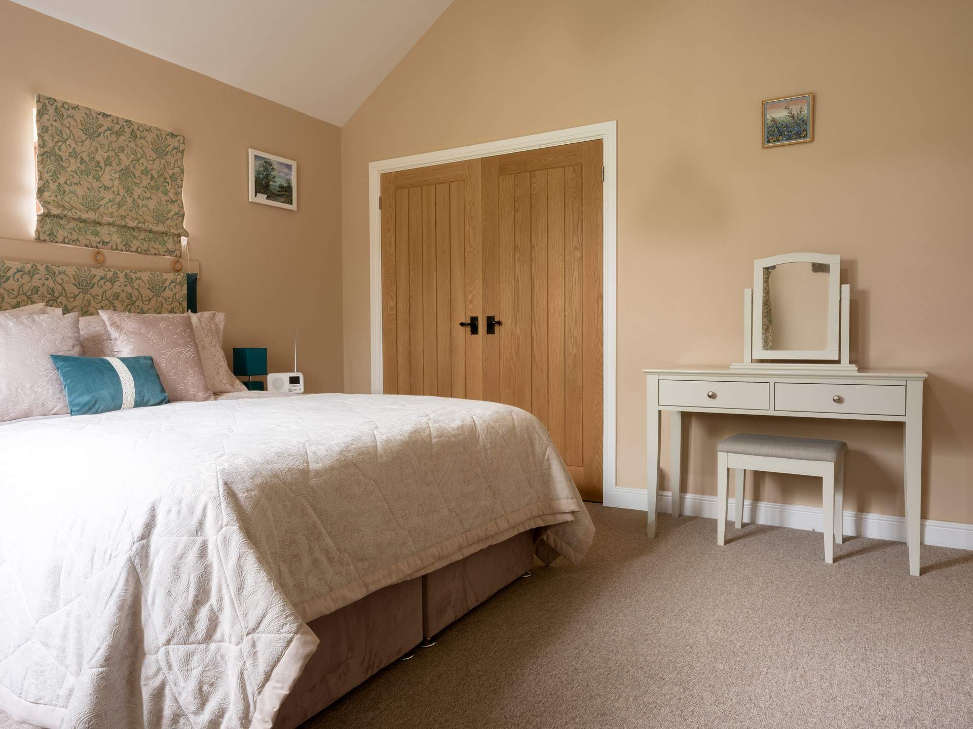 The primary is cosy and quiet and features a king size bed and beautiful en-suite
