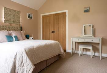 The primary is cosy and quiet and features a king size bed and beautiful en-suite