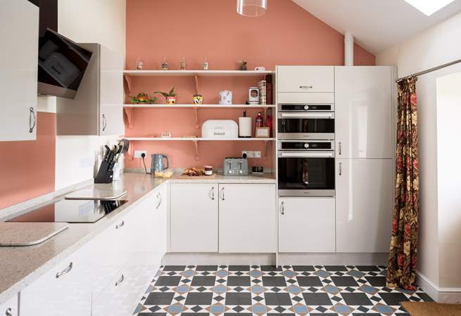 The modern kitchen is well thought out with lots of prep space and all the expected appliances