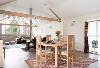 The open plan living space is wonderful bright place to be, with views out of the huge windows to Glastonbury Tor