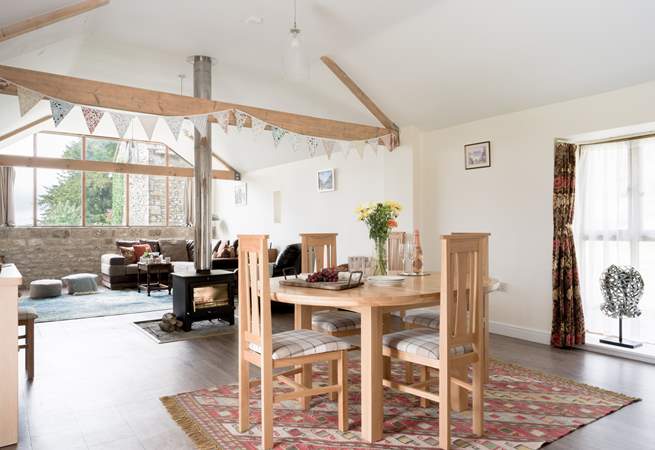 The open plan living space is wonderful bright place to be, with views out of the huge windows to Glastonbury Tor