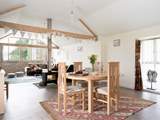 The open plan living space is wonderful bright place to be, with views out of the huge windows to Glastonbury Tor