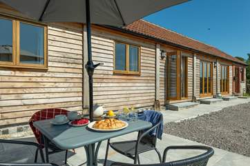 There is a sun-drenched south-facing patio and three sets of French windows from the open plan living-area!